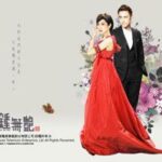 Woman in red gown and man in tuxedo
