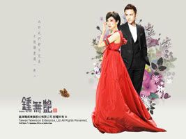 Woman in red gown and man in tuxedo