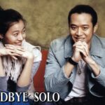 Two smiling people on couch, "Goodbye Solo