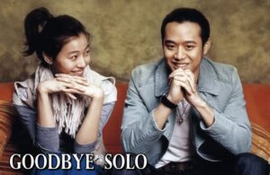Two smiling people on couch, "Goodbye Solo