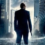 Man in suit with gun in flooded city