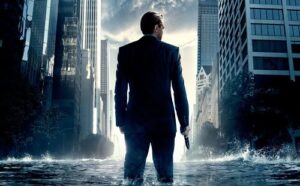 Man in suit with gun in flooded city