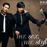 Two men in suits, one holding a falcon