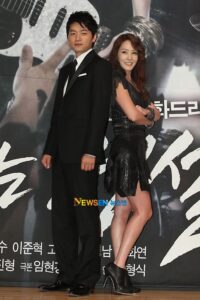 Two people in formal attire posing
