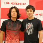 Two men posing in front of Eider backdrop