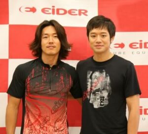 Two men posing in front of Eider backdrop
