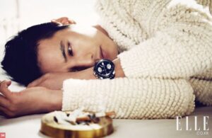 Man lying with watch and cigarette ashtray