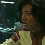 Person in sci-fi spaceship control room