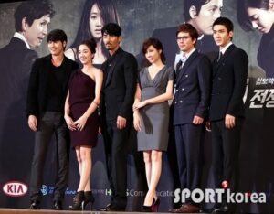 Group of formally dressed people posing at event