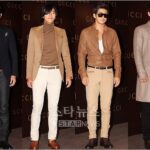 Four men posing at Gucci fashion event