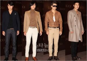 Four men posing at Gucci fashion event