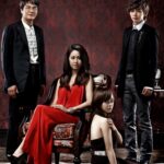 Four fashionable people in elegant vintage room