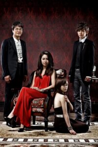 Four fashionable people in elegant vintage room