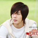 Young man with layered brown hair outdoors