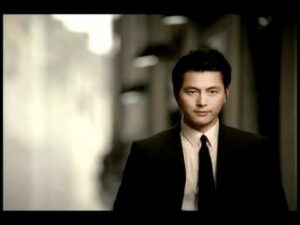Man in suit walking down hallway