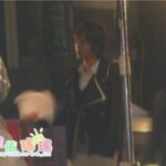 Blurred person holding papers on film set