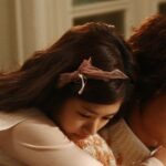 Woman hugging man from behind, tender moment