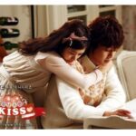 Romantic couple hugging at table