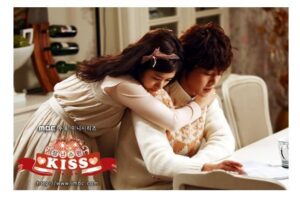 Romantic couple hugging at table