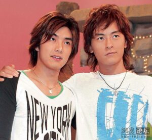 Two young men posing arm in arm