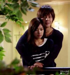 Young couple embracing tenderly on indoor balcony