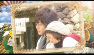 Young couple cuddling outdoors near stone wall