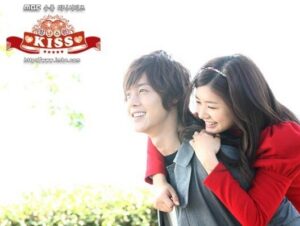 Young couple smiling, woman on man's back