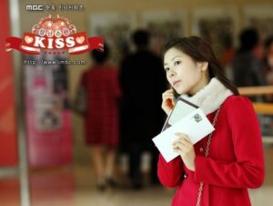 Young woman in red coat holding papers