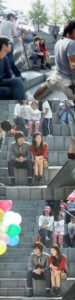 People sitting on outdoor stone steps at event