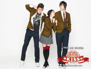 Three students in school uniforms posing together