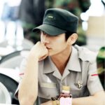 Soldier in uniform with heart-sticker bottle
