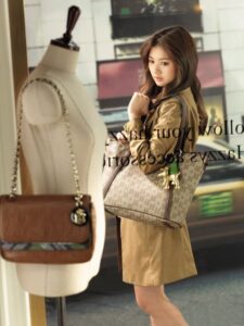 Woman holding designer tote bag in boutique