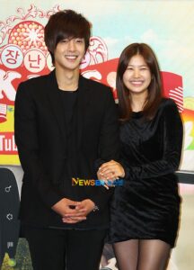 Smiling young couple holding hands