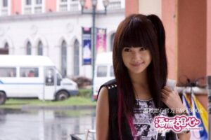 Smiling woman with long dark hair outdoors