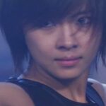 Close-up of young person with short hair