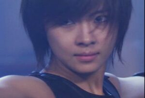 Close-up of young person with short hair