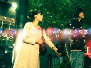 Two people holding hands on night street