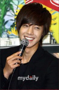 Smiling man holding microphone