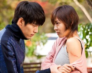 Man and woman confront each other outdoors