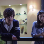 Pensive young adults leaning on balcony railing