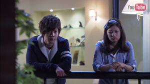 Pensive young adults leaning on balcony railing