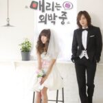 Bride in red sneakers with tuxedoed groom