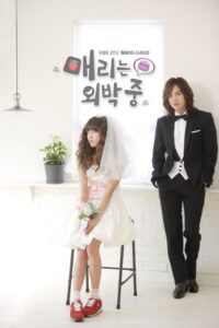 Bride in red sneakers with tuxedoed groom