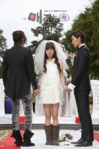 Bride between two men at outdoor wedding