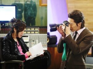 Woman in studio, man taking photograph