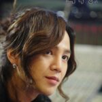 Close up portrait of person with wavy hair