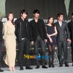 Group of seven posing at film premiere
