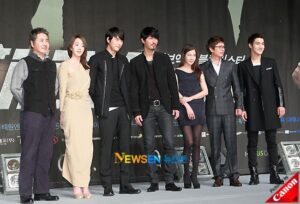 Group of seven posing at film premiere