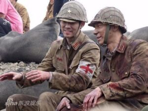 Two soldiers in vintage uniforms, medic armband