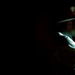 Profile of man wearing hat and glasses